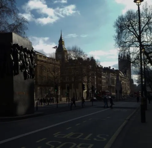 Easton service area: a sunlit street of ornate stone buildings running toward a Gothic clock tower