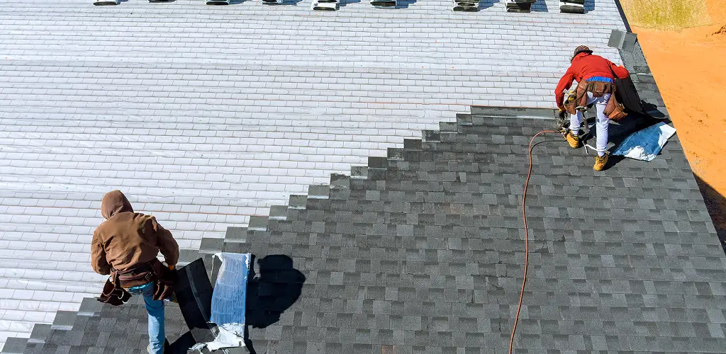 New roof installation process Allentown home with roofers working on a new roof
