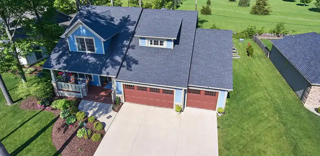 Roof warranty guide Allentown homeowner discussing warranty details with a roofing expert